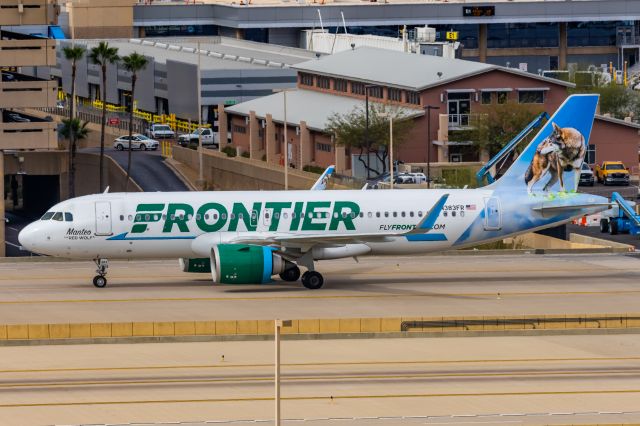 Airbus A320neo (N383FR) - A Frontier Airlines A320 neo "Manteo the Red Wolf" taxiing at PHX on 2/13/23, the busiest day in PHX history, during the Super Bowl rush. Taken with a Canon R7 and Canon EF 100-400 II L lens.