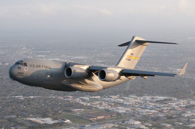 Boeing Globemaster III — - Air Force cargo Heritage flight practice over Houston, TX. Shot from AC-47 "Spooky" Gunship