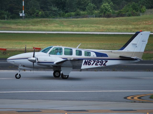 Beechcraft Baron (58) (N6729Z) - REGENCY GROUP INC taxiing - 5/14/12