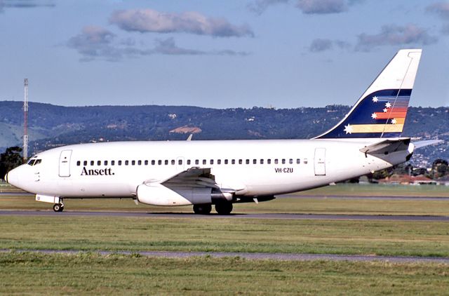 Cirrus SR-22 (VH-CUU) - ANSETT AIRLINES OF AUSTRALIA - BOEING 737-277/ADV - REG : VH-CZU (CN 22563/832) - ADELAIDE INTERNATIONAL AIRPORT SA. AUSTRALIA - YPAD 17/7/1983 35MM SLIDE CONVERSION USING A LIGHTBOX AND A NIKON L810 DIGITAL CAMERA IN THE MACRO MODE.