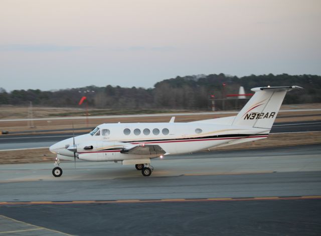 Beechcraft Super King Air 300 (N312AR) - Taxiing to ramp at PDK on 02/16/2011