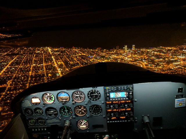 Cessna Skyhawk (N2476X) - Flying just north of downtown Milwaukee. Taken with a Google Pixel XL