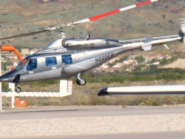 Bell 222 (N222EX) - Lifting off from Redlands Muni