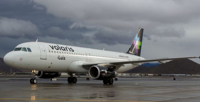 Airbus A320 (N515VL) - Volariss "Luis" (N515VL), an A320, heads north on taxiway Alpha toward the terminal at Reno Tahoe International after arriving from Guadalajara.  