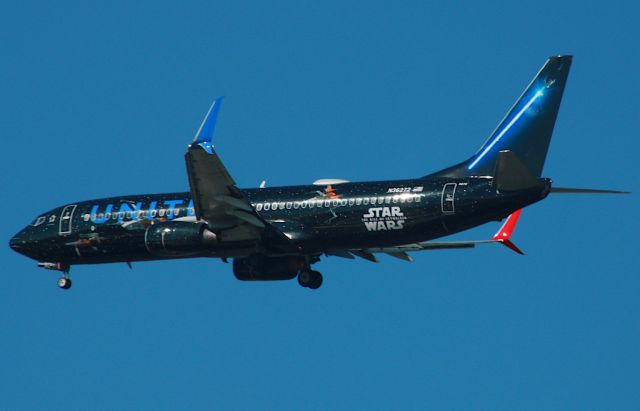 Boeing 737-800 (N36272) - UNITED 786 arriving from Denver with  a very rare livery! Photo taken through a windshield on 2/19/2021.