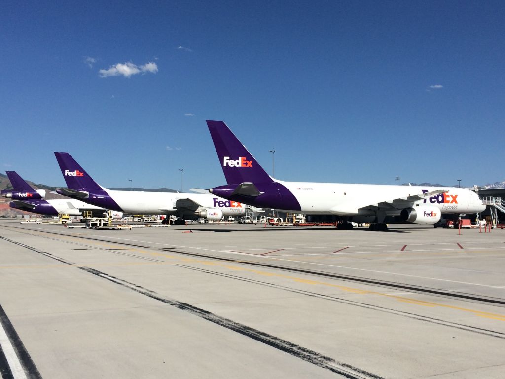 — — - From background to foreground: FedEx MD-11, A300-600, and 757-200 at SLC.