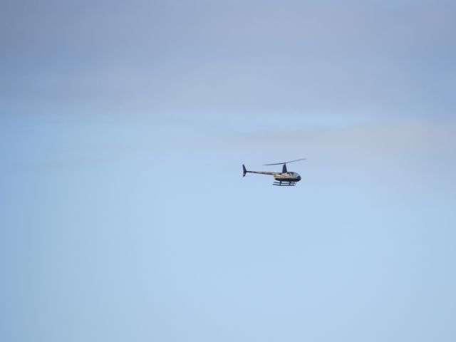 Robinson R-44 (N272DW) - I was standing on the  dock watching live music over looking the La Have River in Bridgewater NS