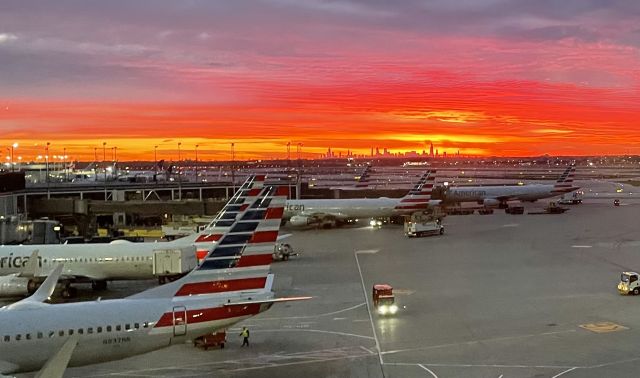 — — - Sunrise at ORD with the Chicago skyline in the background