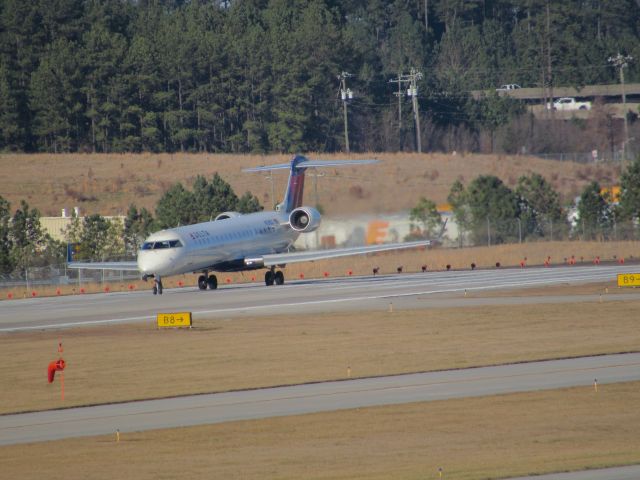 Canadair Regional Jet CRJ-700 (N738EV) - Delta Connection (ExpressJet) flight 5205 to Cleveland-Hopkins Intl, a Bombardier CRJ700 lined up takeoff on runway 23R. This was taken January 30, 2016 at 3:45 PM.