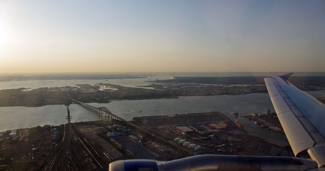 Boeing 757-200 — - NEWARK AIRPORT-NEWARK, NEW JERSEY, USA-OCTOBER 05, 2011: After take off from Newark Airport, a view of Newark Bay can be seen in the foreground.