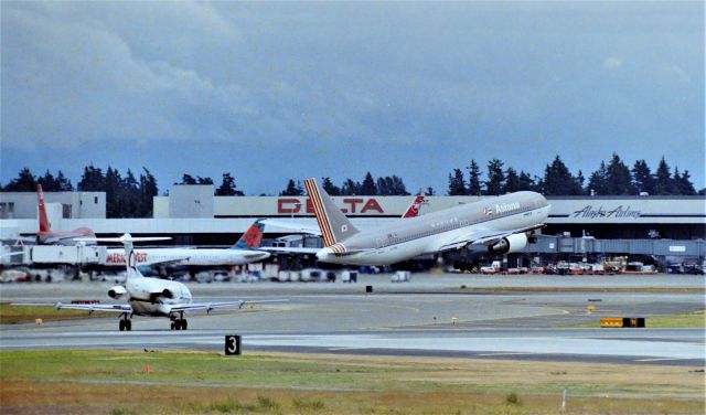 BOEING 767-300 (HL7266) - KSEA - odd angle and a faded negative, Seattle had one of the best aircraft viewing areas on the west coast. Now long gone after Seattle added a 3rd Runway i thought I'd post this photo from the AirPark to show those who never made it out there how nice it was. Asiana 767 departing for So Korea here among a mix of older airlines. The bad prt about this viewing spot was it was usually very crowded and minimal parking spaces. When clear, majestic Mt. Rainier was visible in this view.