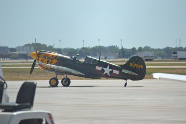 CURTISS Warhawk (N401WH) - P-40 sitting on tarmac in KFSD