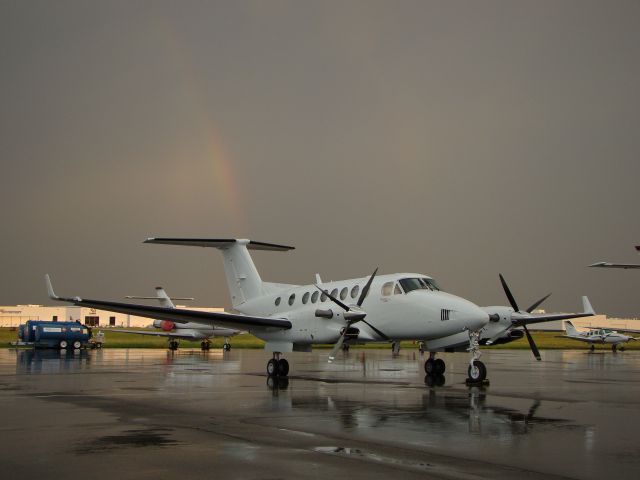 Beechcraft Super King Air 350 — - Rainbow behind King Air.