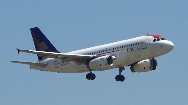 Airbus A319 (N478TA) - The only aircraft left in the old "TACA" livery approaches RWY 18R at DFW after a flight from San Salvador!