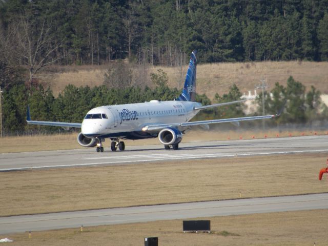 Embraer ERJ-190 (N328JB) - JetBlue flight 1084 to Logan Intl, an Embraer 190 on takeoff roll on runway 23R. This was taken January 30, 2016 at 3:30 PM.