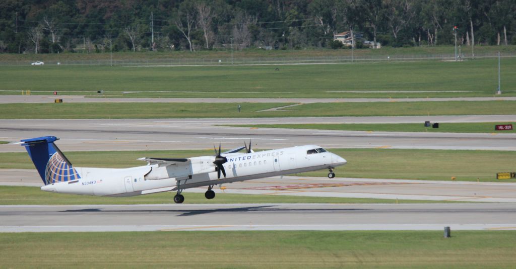 de Havilland Dash 8-400 (N204WQ) - 081415 rotating from Rwy 14R