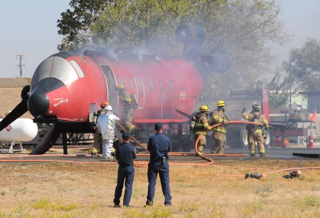 — — - Airport firefighters training at KMCE