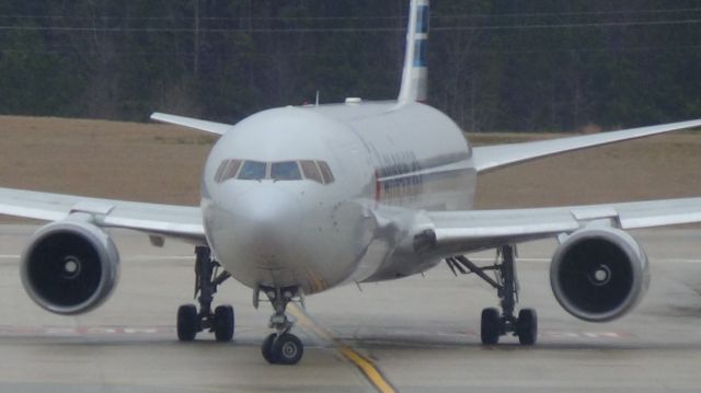 BOEING 767-300 (N372AA) - Turning right in front of the camera! American 173 arriving from London LHR at the beginning of a shower!  Taken March 19, 2015.