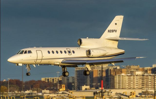 Dassault Falcon 50 (N28PH) - A setting November sun illumines this Falcon on finals for runway 33L at YYZ