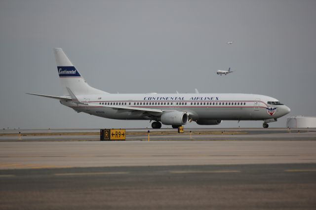 Boeing 737-900 (N75436) - 737 in retro Continental livery taking off to the east this morning (3-12-2012) on runway 8 at DIA.