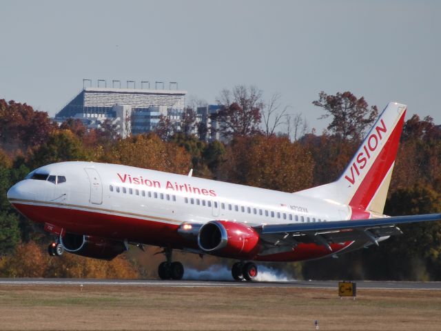 — — - Touching down on runway 02 with the Charlotte Motor Speedway in the background. Here to pick up a few NASCAR teams for the last race of the season in Miami - 11/18/10
