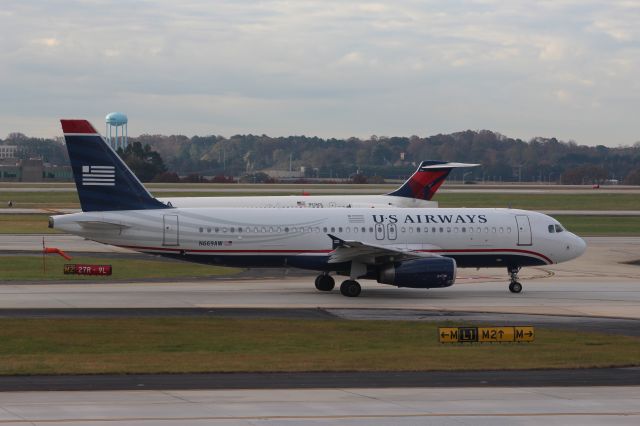 Airbus A320 (N669AW) - She sure was a sight for sore eyes, this livery!