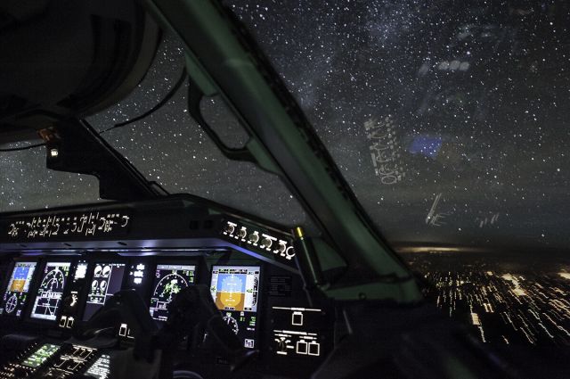 Embraer 170/175 — - Blasting north under a starry sky 