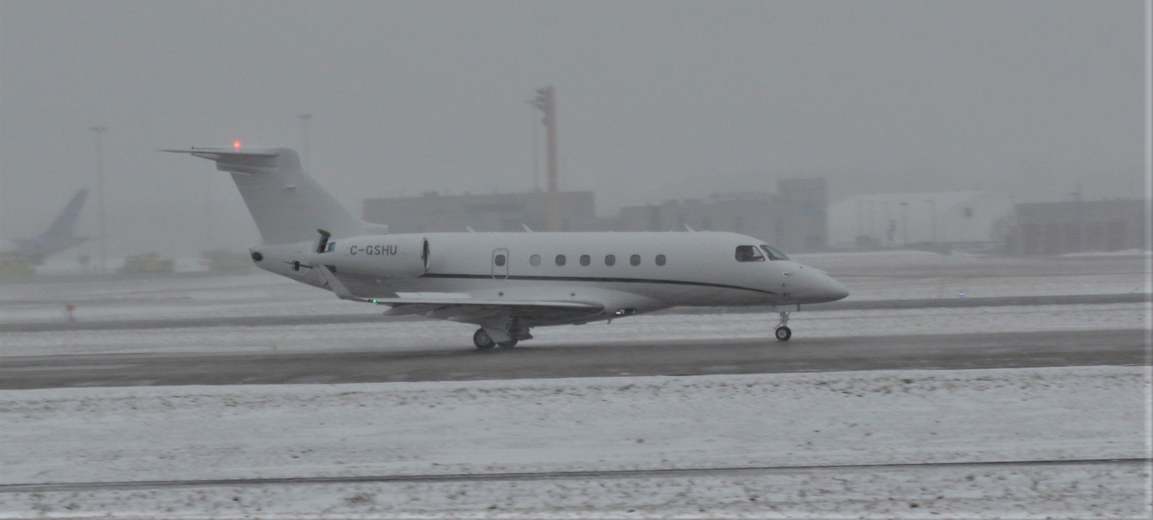 Embraer Legacy 550 (C-GSHU) - Taken during a snow storm in CYUL