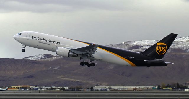 BOEING 767-300 (N382UP) - Just off 17L and on the climb into an overcast sky enroute to San Jose (KSJC).