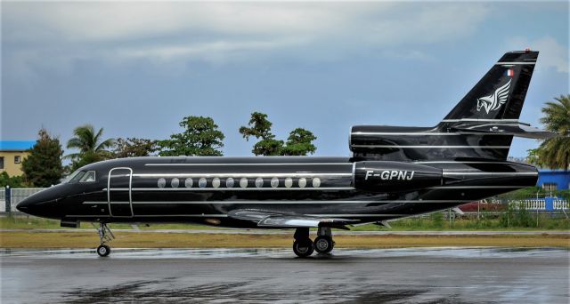 Dassault Falcon 900 (F-GPNJ) - Falcon 900 registered as F-GPNJ sporting her new looks while back tracking for parking at St Maarten.