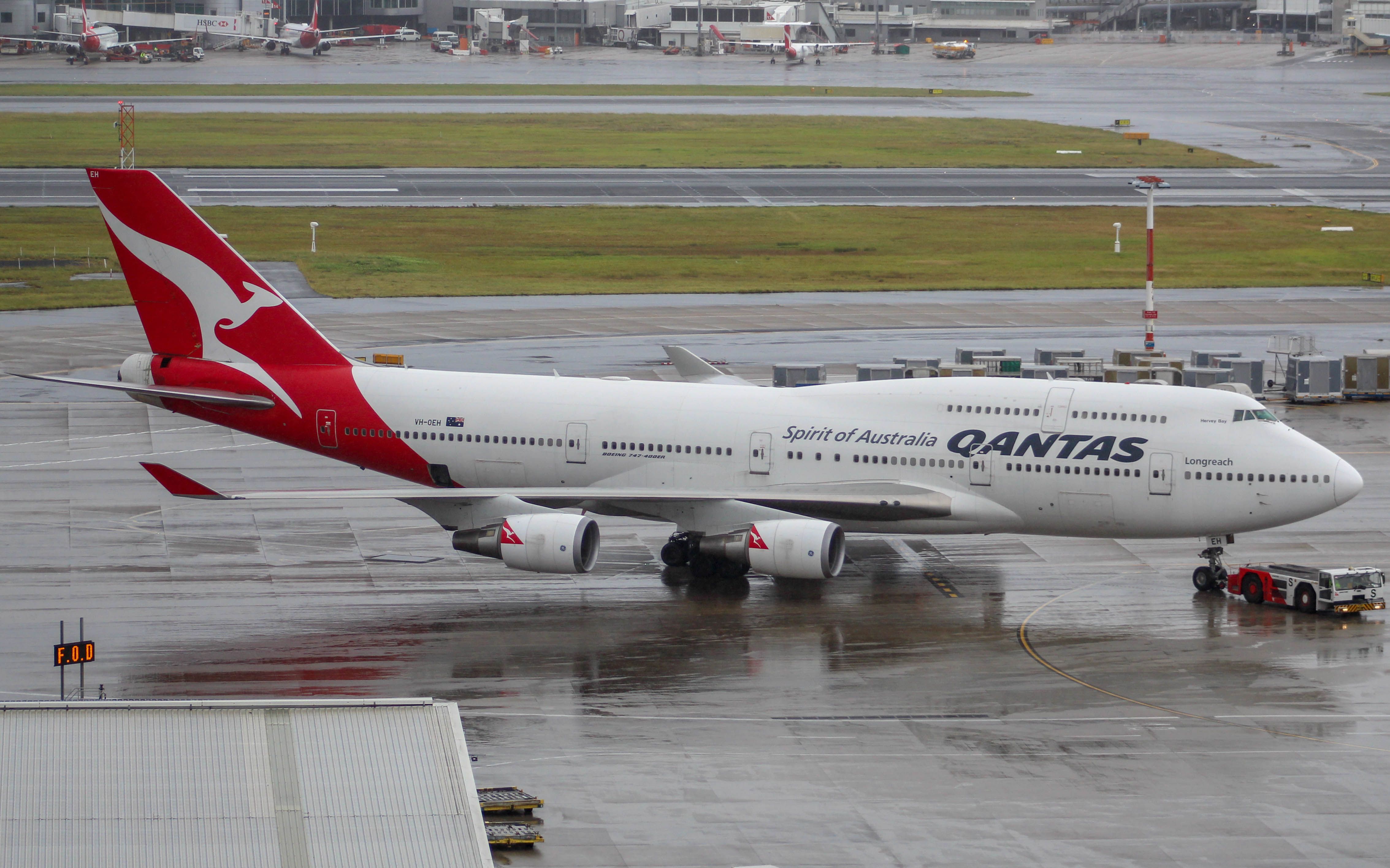 Boeing 747-400 (VH-OEH) - OEH getting towed inti Bay 8!