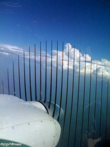 Beechcraft Baron (58) (N4331W) - Turning prop of our Beech Baron 58, taken from the left seat during flight.