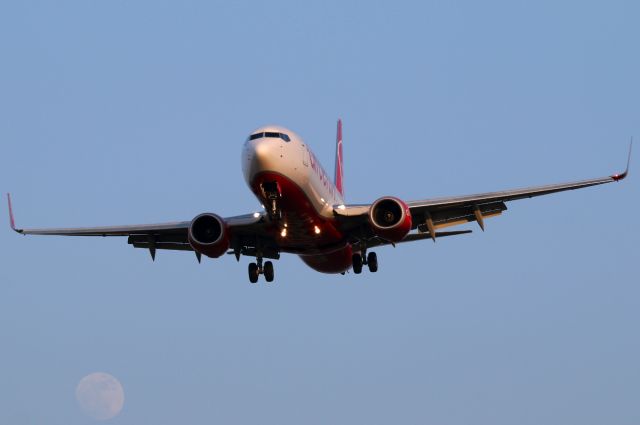 Boeing 737-800 (D-ABKS) - Note the moon in the left corner.