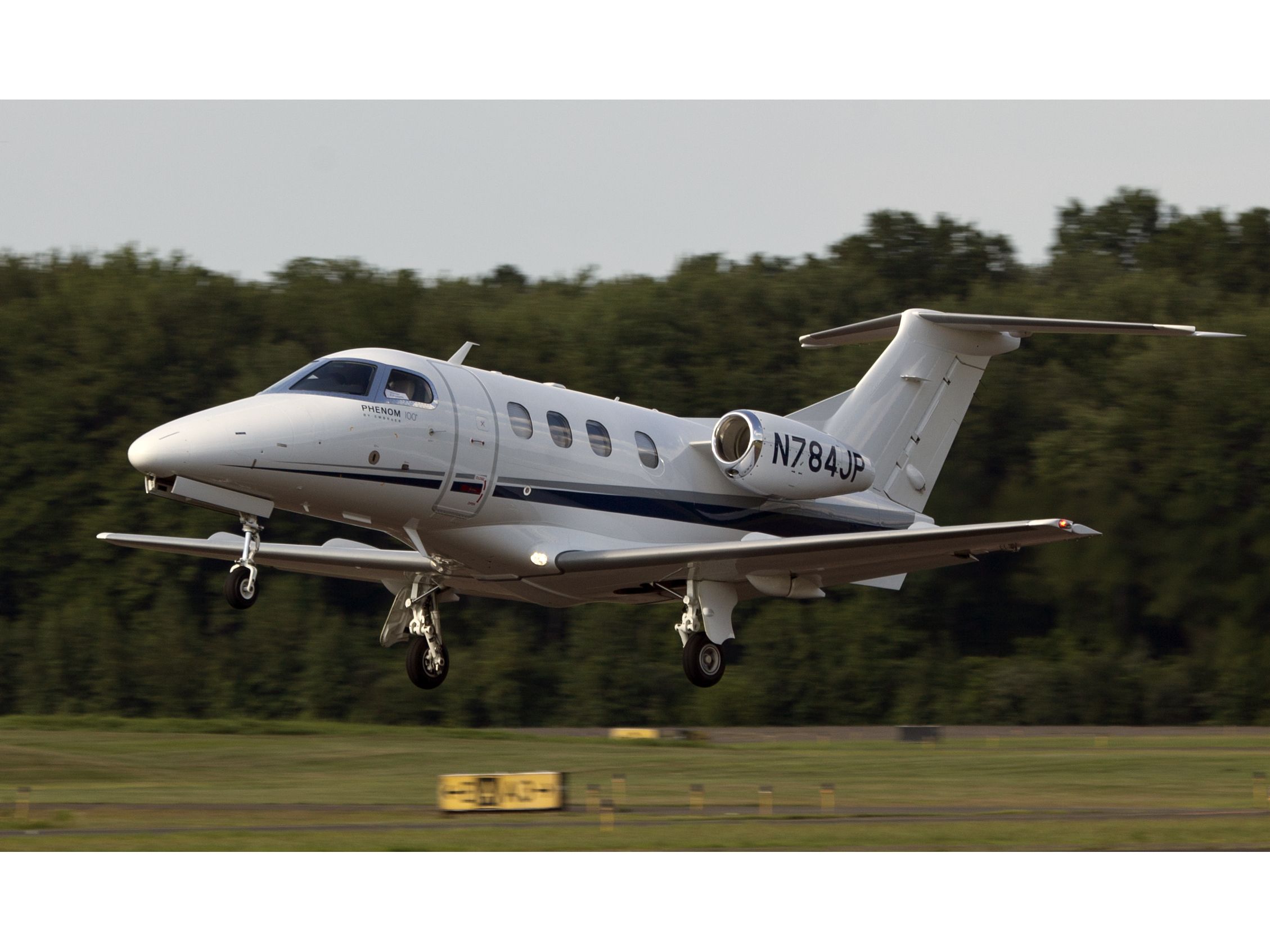 Embraer Phenom 100 (N784JP) - Take off RW26. CFM (Corporate Flight Management) has a brand new Phenom 100 available for charter in the New York metropolitan area. KDXR KHPN KTEB KBDR   www.flycfm.com