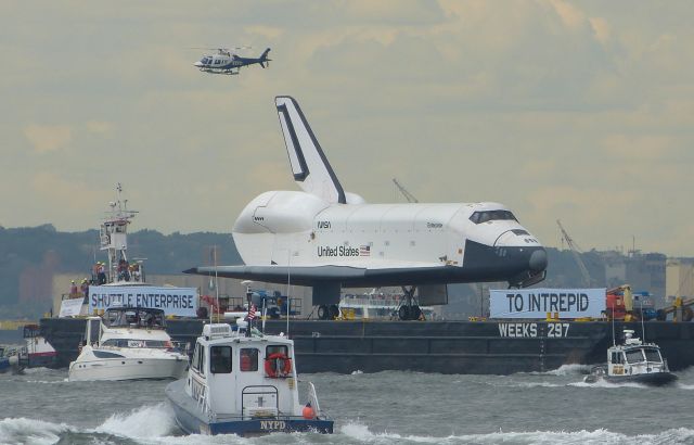 BOEING 737-300 (ELL101) - Space Shuttle Enterprise on the final leg of her journey to her new home at the Intrepid Air Sea and Space Museum in NYC, seen here on June 6, 2012 passing Battery Park in lower Manhattan on the Hudson River, an Amazing site to witness.