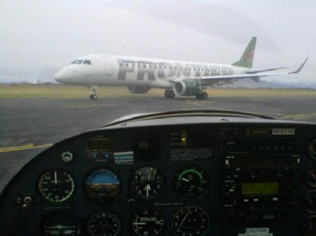 Embraer ERJ-190 (N161HL) - Holding for N161HL to pass then taxi for takeoff on Runway 31 @ KPVU. 11/15/2011