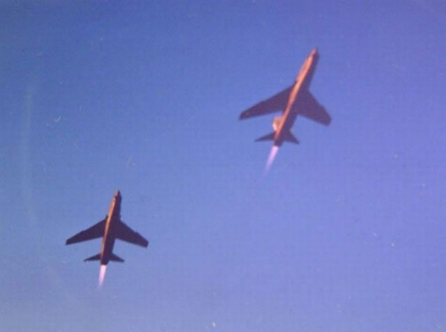 — — - Early morning takeoff, RF-8 Crusaders at Dallas NAS in the late '60s.