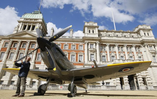 — — - Keith Lee, an RAF employee puts the finishing touches to a Second World War Spitfire Mk XVI, in Horse Guards Parade in London, Thursday, March 31, 2016. A Pop-Up RAF aircraft museum was on Horse Guards Parade to mark the centenary of the Royal Air Force.The planes were transported to the capital ahead of the 100th anniversary of the RAF. The display was organised by the RAF Museum to highlight the way the air force has shaped the modern world and touched the lives of millions. (AP Photo/Kirsty Wigglesworth) ORG XMIT: LKW112