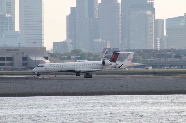 Canadair Regional Jet CRJ-700 (N182GJ) - A Delta Connection CRJ700 waits for takeoff at Logan.