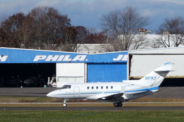 Hawker 800 (N979CF) - Heading down the active runway for departure is this 2011 Hawker Beechcraft 900XP in the Autumn of 2018.