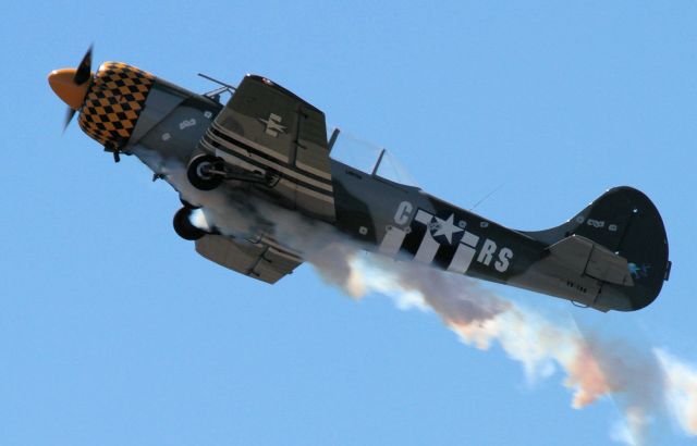 YAKOVLEV Yak-52 (VH-YRO) - Immersed in his own smoke during airshow routine - I enjoyed the effect of the sun behind the plane and smoke and the shadows it created