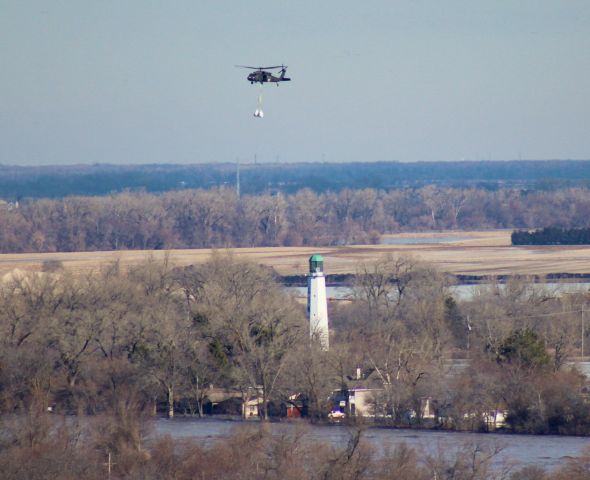 — — - 3/16/19 sandbagging operations along the Platte River at Ashland, NE. Over the Linoma Beach lighthouse