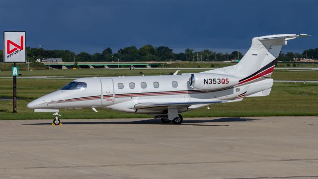 Embraer Phenom 300 (N353QS) - A Netjets Phenom 300 sits on the ramp at KVPZ.