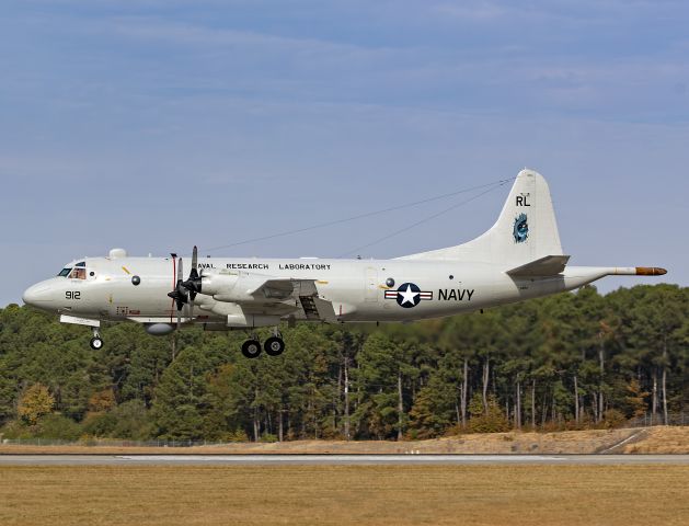 Lockheed P-3 Orion (15-8912) - WARLOK4, a US Navy P-3C from the Naval Research Laboratory, Scientific Development Squadron (VXS) 1, the Warlocks, based at Naval Air Station Patuxent River, MD, conducting a touch ‘n go on 9 Nov 2023. He snuck in on me from behind the trees, so I didn’t have time to slow my shutter, but I was able to catch a few shots of him.