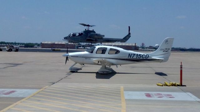 Cirrus SR-22 (N715CD) - Cobra 4 niner cleard to land on the Cirrus. We found a great way to stay cool during preflights in 100 plus temps in Oklahoma.