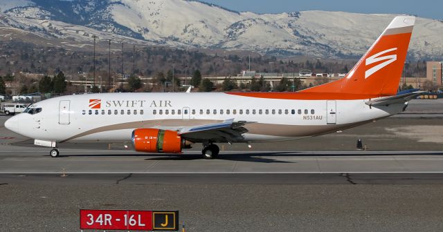 BOEING 737-300 (N531AU) - This former US Airways B733 (N531AU), now flying in Swift Air paint, is seen in this click taken yesterday (about 9:25 AM) as it employs reverse thrust, brakes, and wing spoilers to slow down after landing on runway 16L at Reno Tahoe International.  