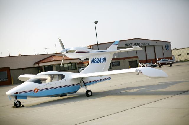 Beechcraft 55 Baron (N824BH) - Home build aircraft out on the ramp at KMOT