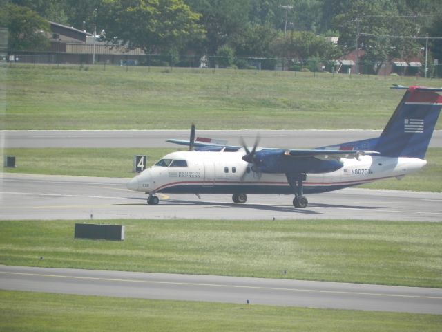 de Havilland Dash 8-100 (N807EX) - A US Airways Dash 8-100 operated by Piedmont taxis to terminal after just landing at Albany International.