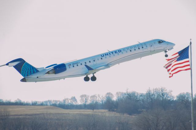 Canadair Regional Jet CRJ-700 (N501GJ) - A most American sight beholds us as this United CR5 solutes the American Flag unit's way out of a small midwestern airport. br /United Express (GO Jet) 4499 is departing Des Moines to Chicago O’Hare at 1:03 PM.