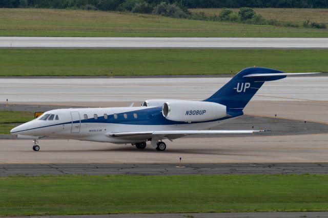 Cessna Citation X (N908UP) - Taxiing out to runway 30 at Dulles, Taken from Garage 2 07/16/2022